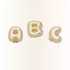 Colgantes Jibbitz™ «Gold Bubble Letter a»