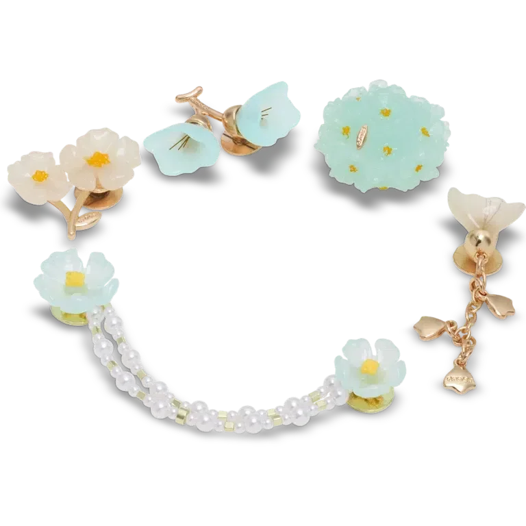 Paquete de 5 colgantes Jibbitz con delicado estampado floral azul Paquete de 5 colgantes Jibbitz con delicado estampado floral azul